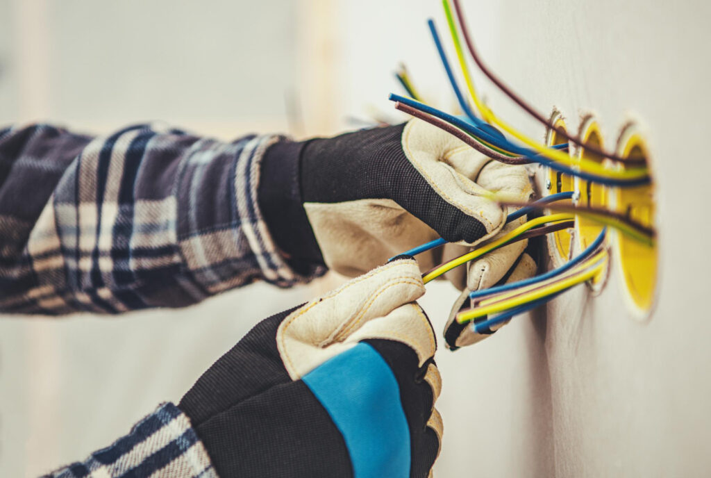 An electrician upgrading electrical system