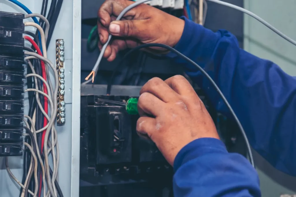 electricalpanel hands repairing electrical panels using bare hands